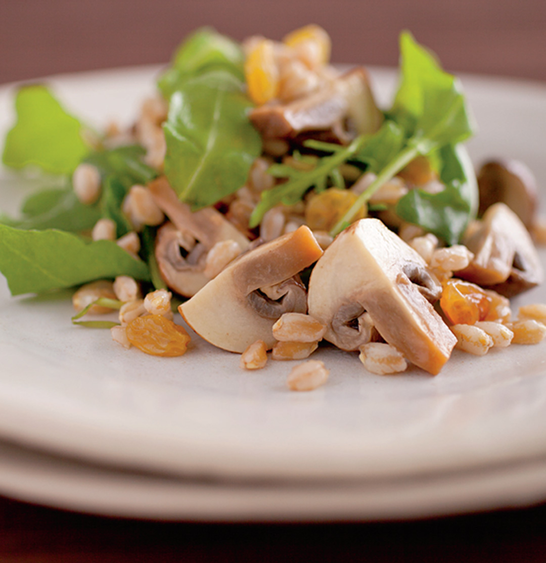Farro Salad with Pickled Mushrooms, Golden Raisins, and Tender Greens
