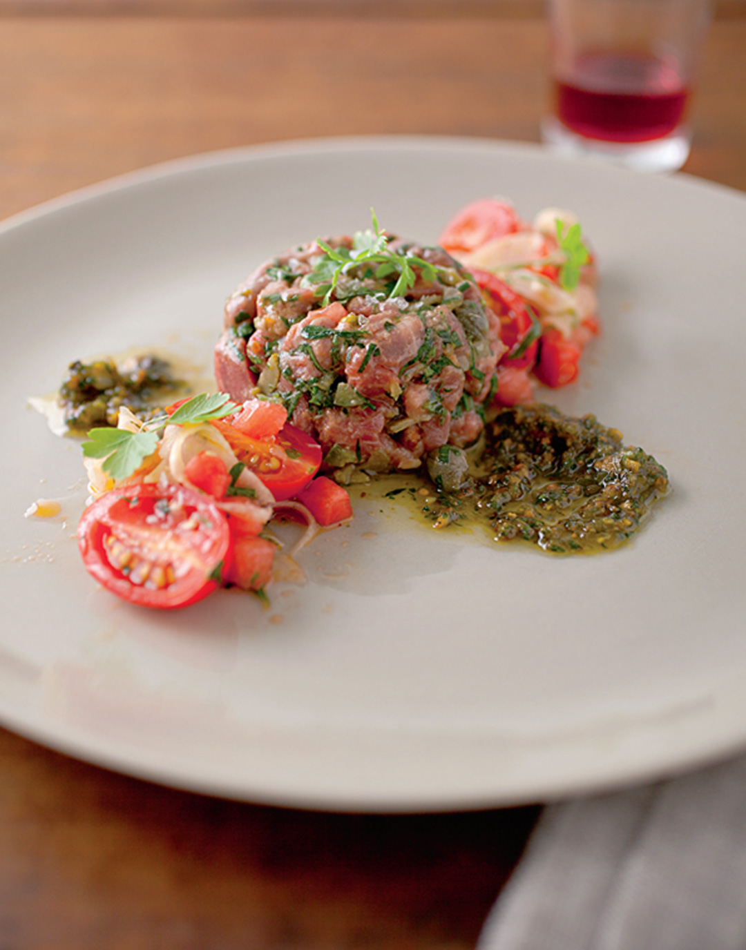 Beef Tartare with Capers, Pistachio Pesto, and WatermelonTomato Salad